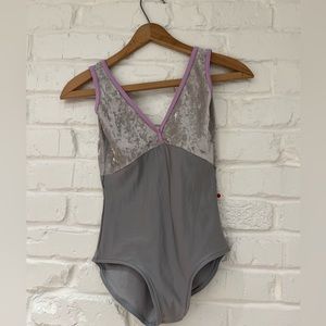 Yumiko gray leotard with lilac trim.